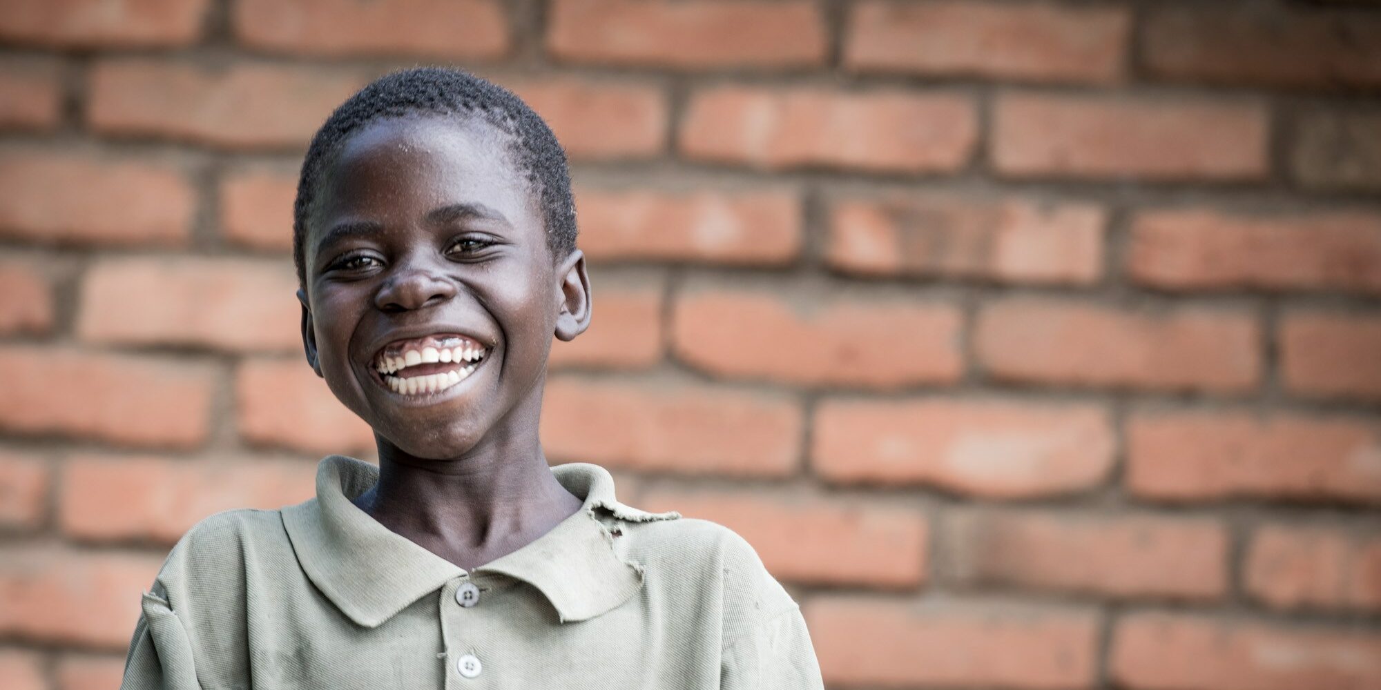Porträt eines lächelnden Jungen in Malawi, Benga